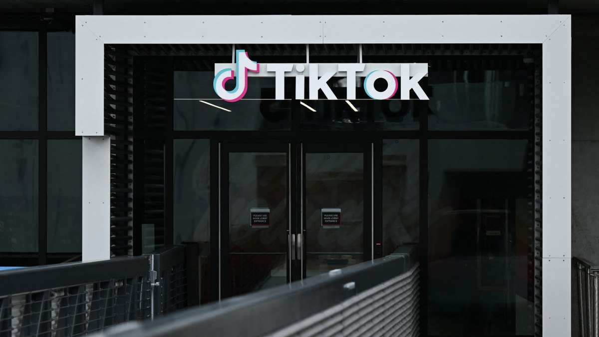 TikTok logo above the company's glass doors