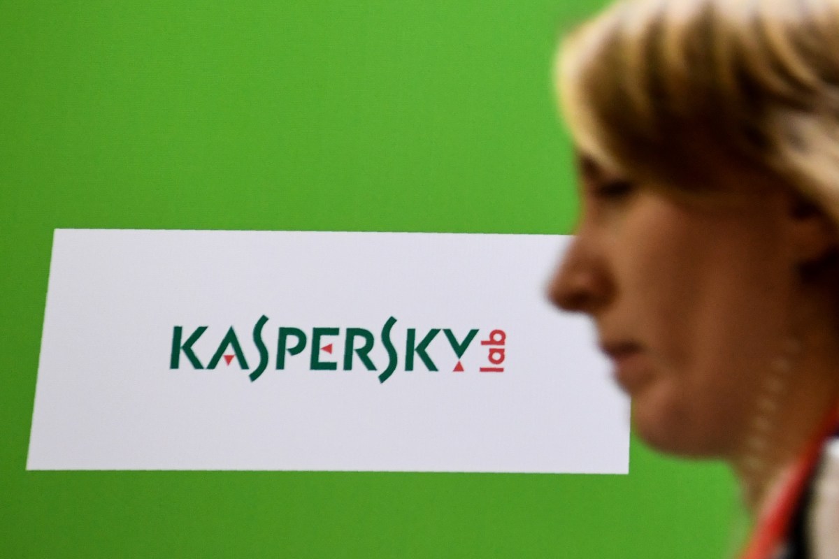 A woman passes the logo of Kaspersky Lab, Russia's leading antivirus software development company.