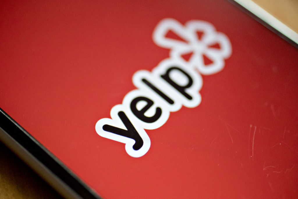 The Yelp Inc. application is displayed on for a photograph an iPhone.